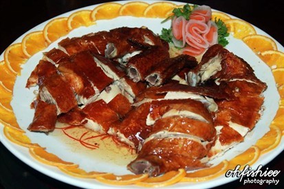 Plum sauce is served right with the chicken.